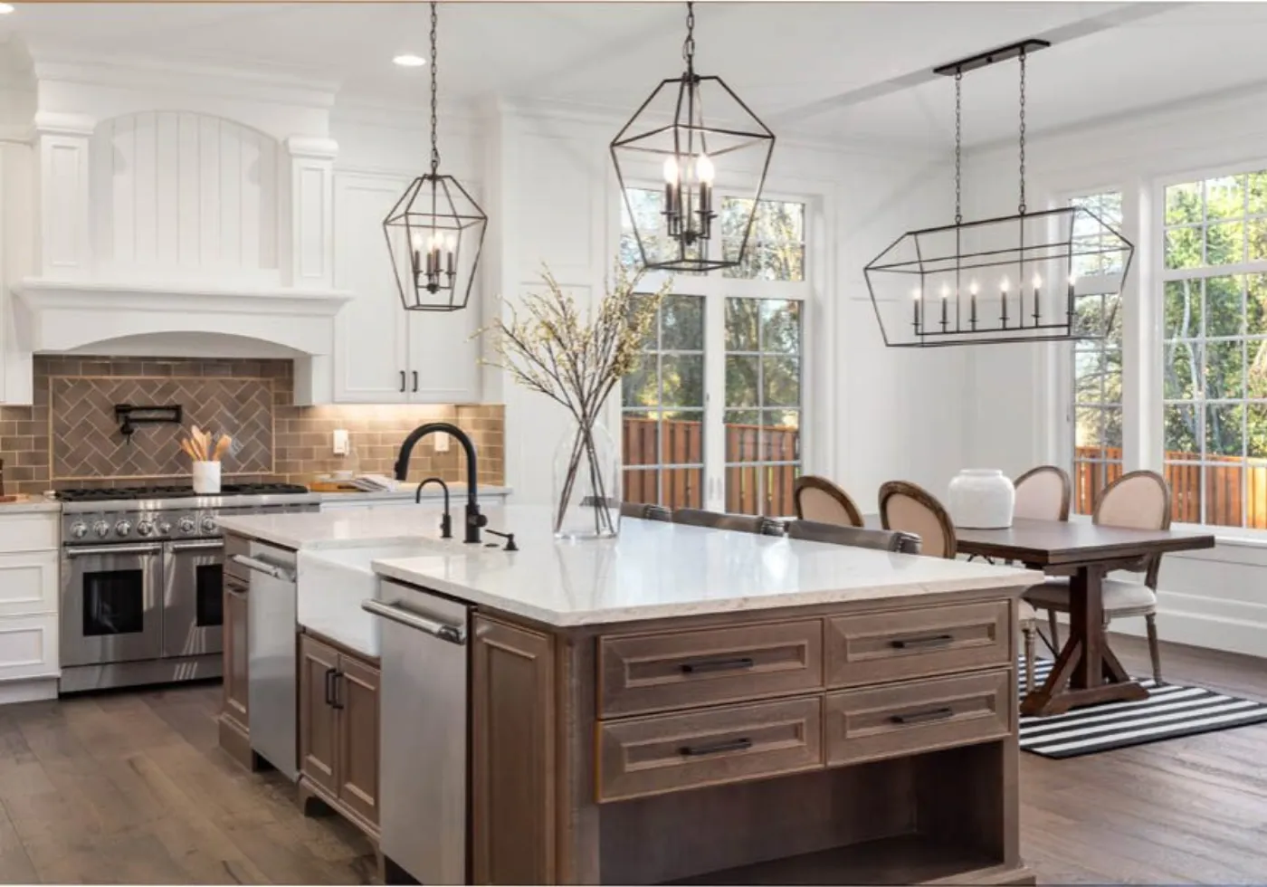 Designer reviewing a kitchen layout with finish and cabinet samples